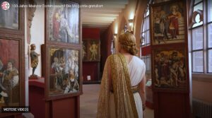 Die "Moguntia" als Führerin durch die Schätze des Dommuseums, hier wertvolle Altarbilder. - Video: Bistum Mainz, Screenshot: gik